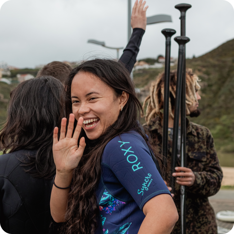 A Gitpod team member waving and smiling.