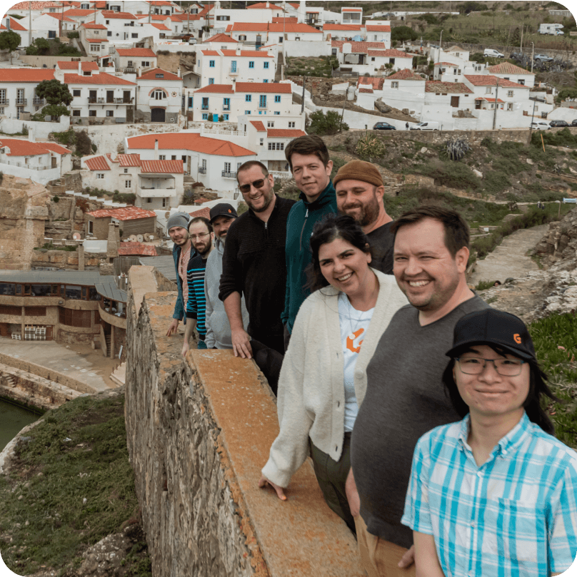 Gitpod team members standing in a group on stairs